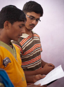 two young men reading