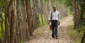 Pastor walking through forest