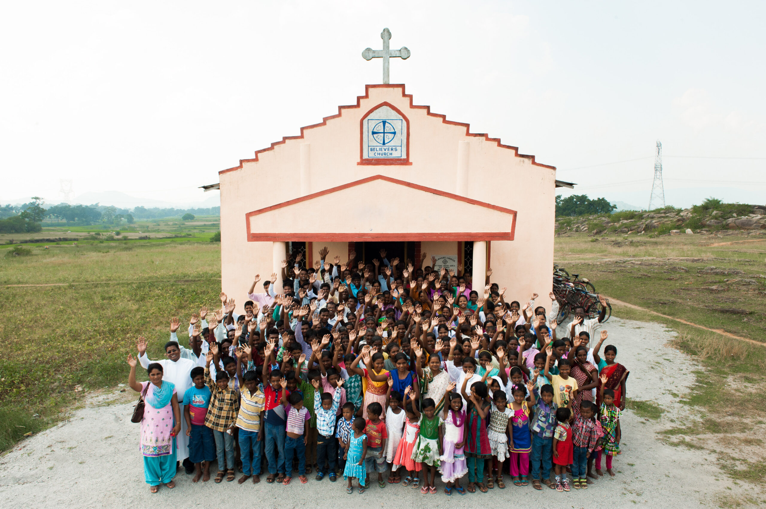Church building with congregation outside