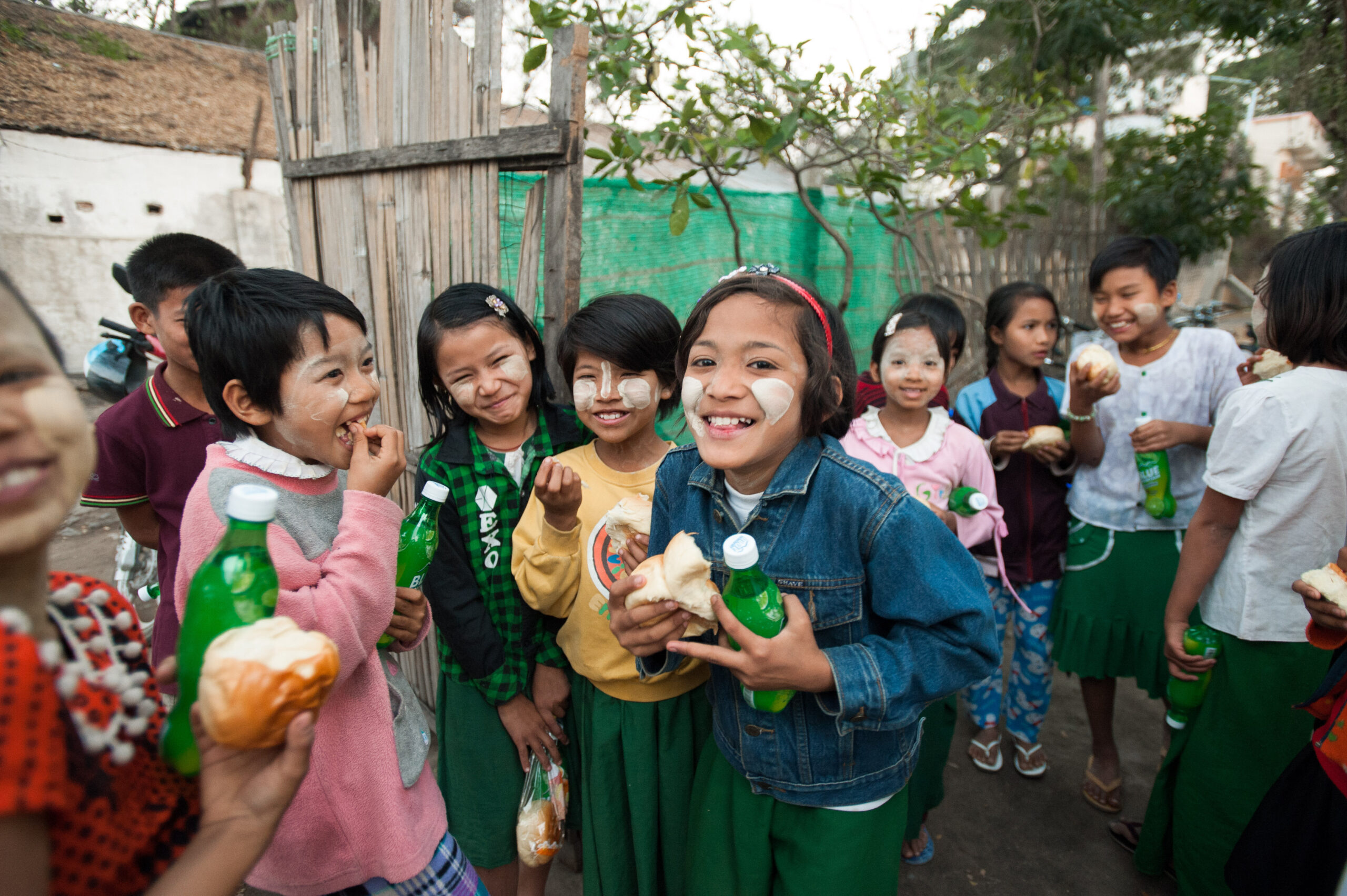 Children eating and drinking together