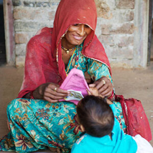 A woman smiling at a child