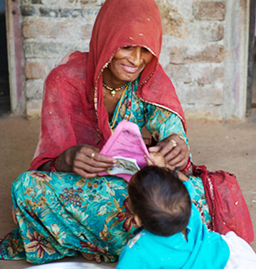 A woman smiling at a child