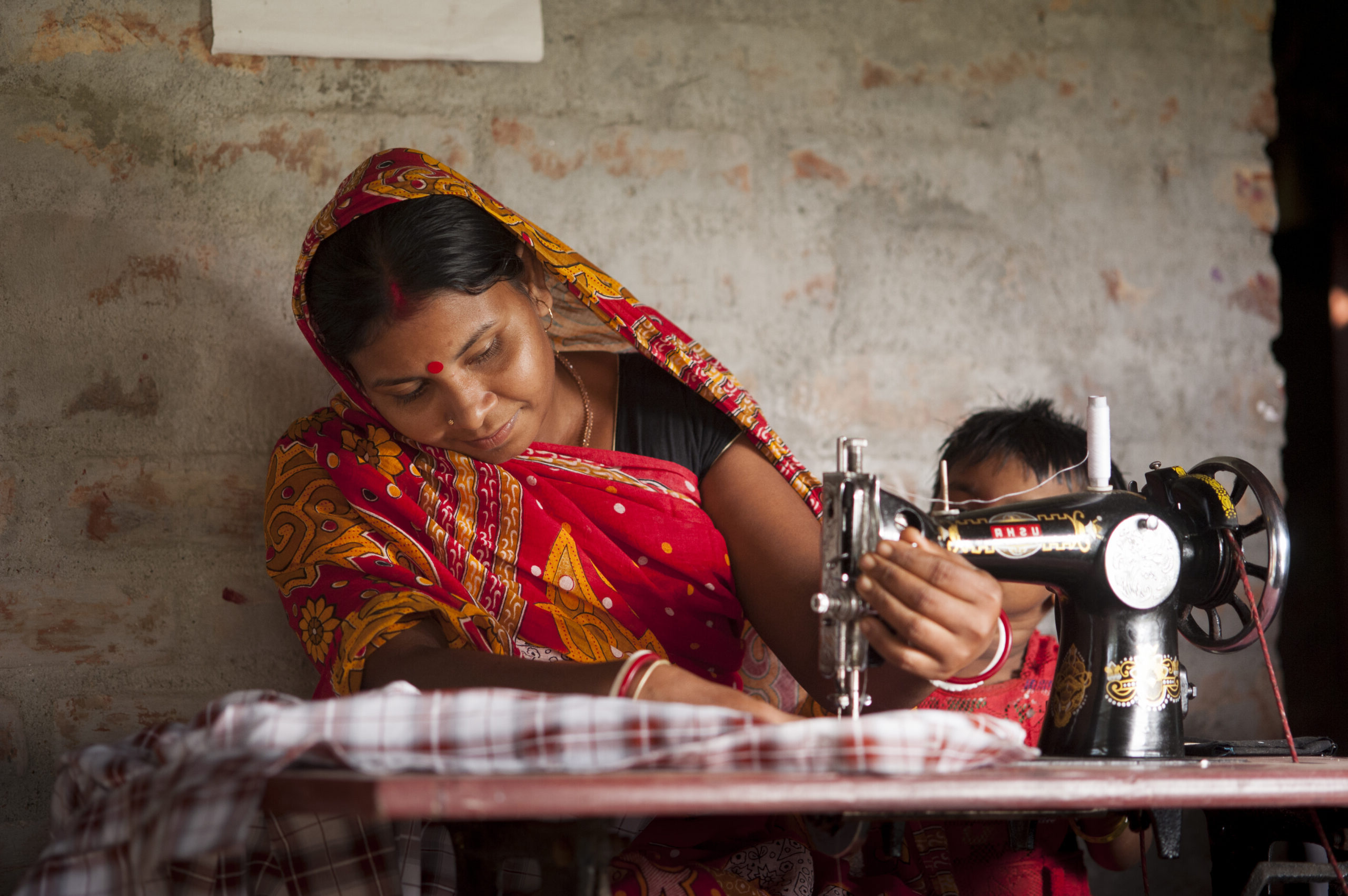 Sewing Machine - Asian lady using a sewing machine